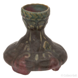 Side view of a vintage art pottery vase with an elegant art nouveau design and earthy pink and green glaze tones