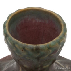 top view of a vintage art pottery vase with an elegant art nouveau design and earthy pink and green glaze tones