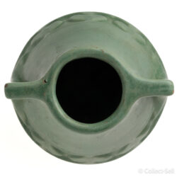 Top view of a vintage Arts and Crafts green pottery vase with dual handles and textured midsection, marked 'NG' on the bottom.