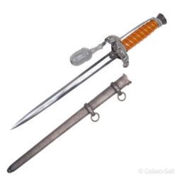 WWII German Army Officer’s Dagger featuring an orange celluloid grip, detailed Wehrmacht eagle crossguard, original silver portapee, polished blade, and pebbled metal scabbard with suspension rings