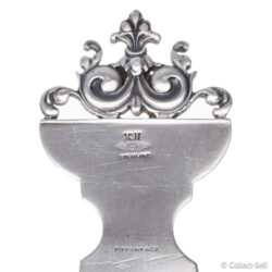 Close-up of Tiffany & Co. hallmark and Baroque scroll handle on sterling letter opener