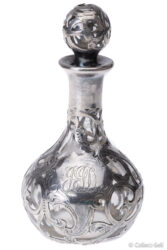 Rear view of bottle showing engraved “JJD” monogram