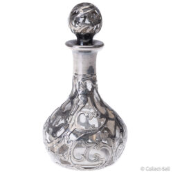 Antique silver overlay glass perfume bottle with ornate stopper, front view