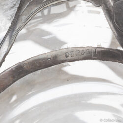 Silver deposit hallmark stamped on lower edge of glass bottle