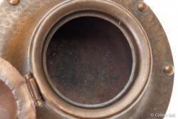 Interior detail of Roycroft inkwell showing age-related oxidation and patina