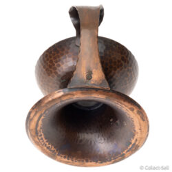 Underside view showing deep bowl shape and surface oxidation