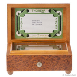 Open box showing Thorens label listing three melodies