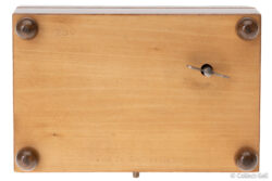 Underside with winding key and “Made in Switzerland” mark