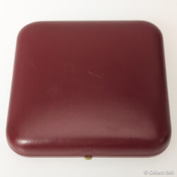Closed red presentation case for the 1984 Wolfson Jr. Collection bronze medal