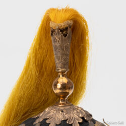 Yellow horsehair plume mounted in brass oak-leaf base with engraved finial